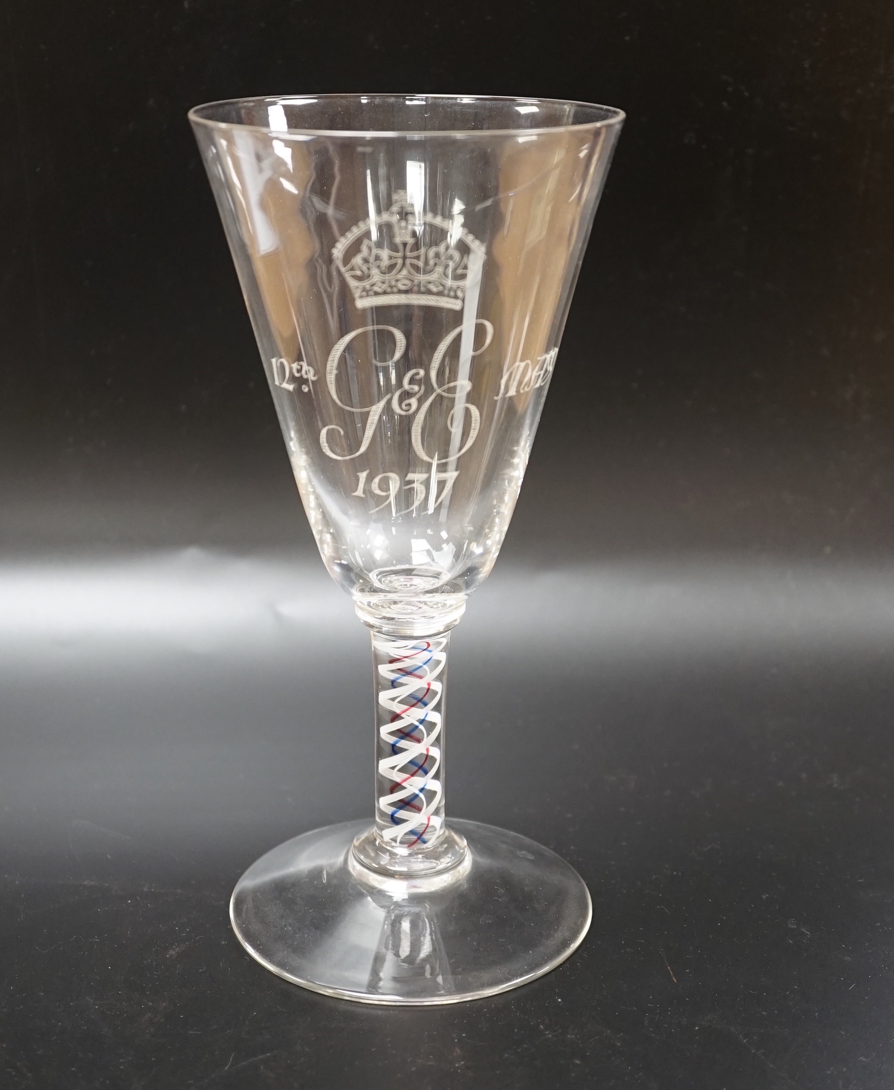 A large George VI commemorative trumpet goblet with etched glass design and cypher dated 1937, stem with red, blue and white colour twist, 22.9cm high